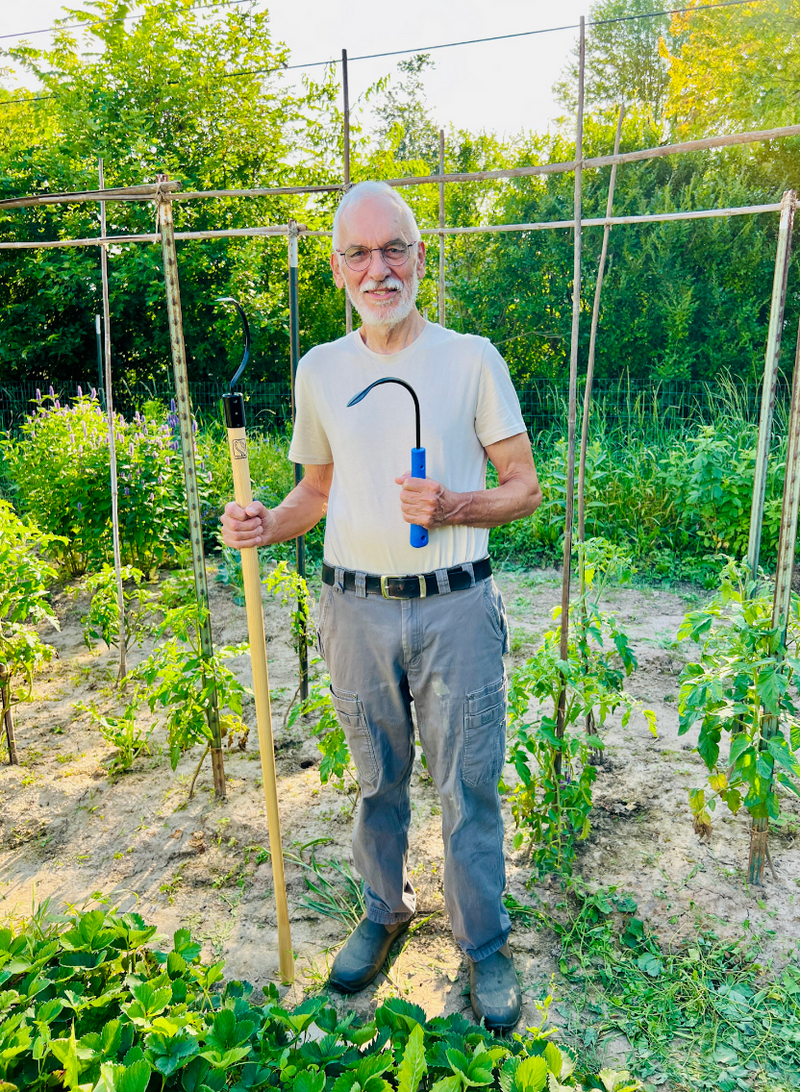 noel holding the original and longhandle weeders